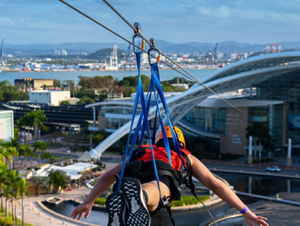 Zip-lining over Distrito T Mobile in San Juan